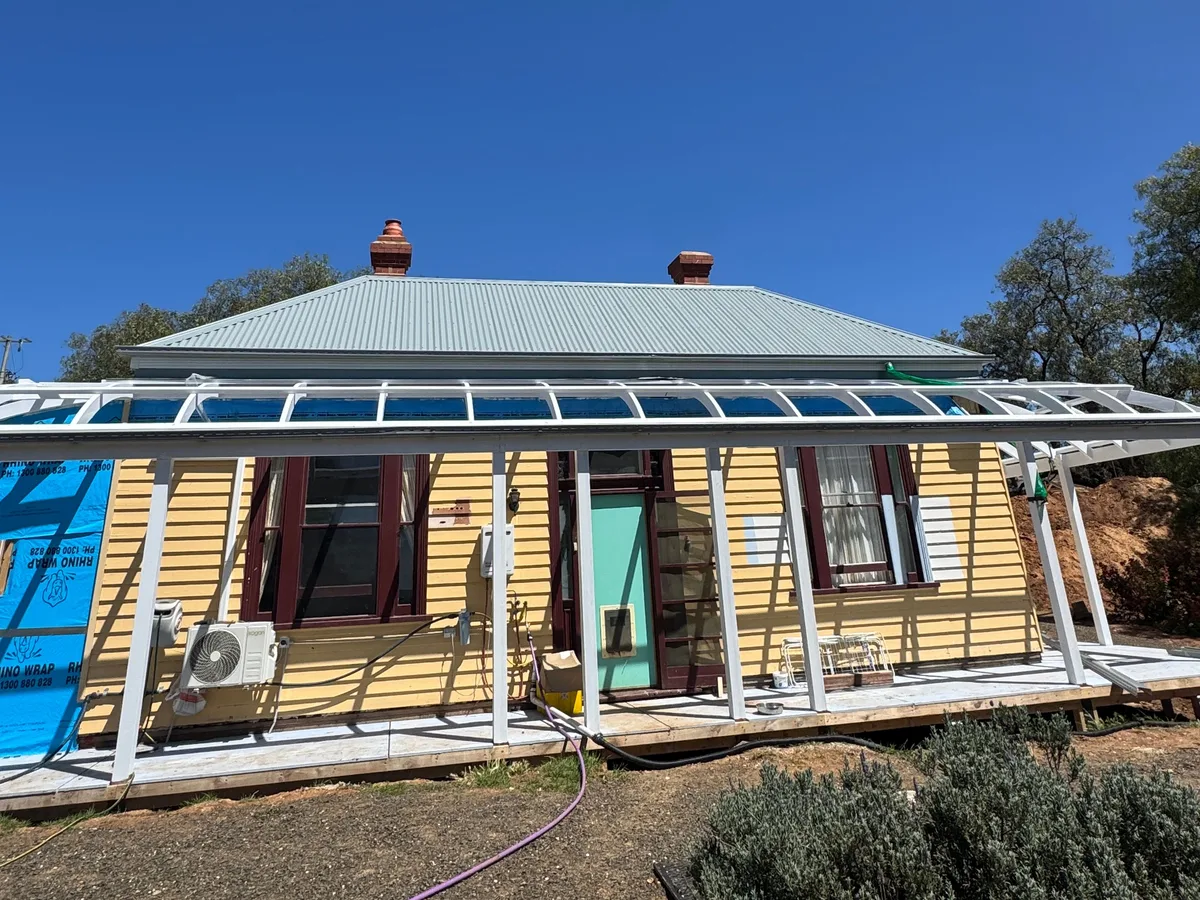 Front verandah framing on a heritage weatherboard home before roofing