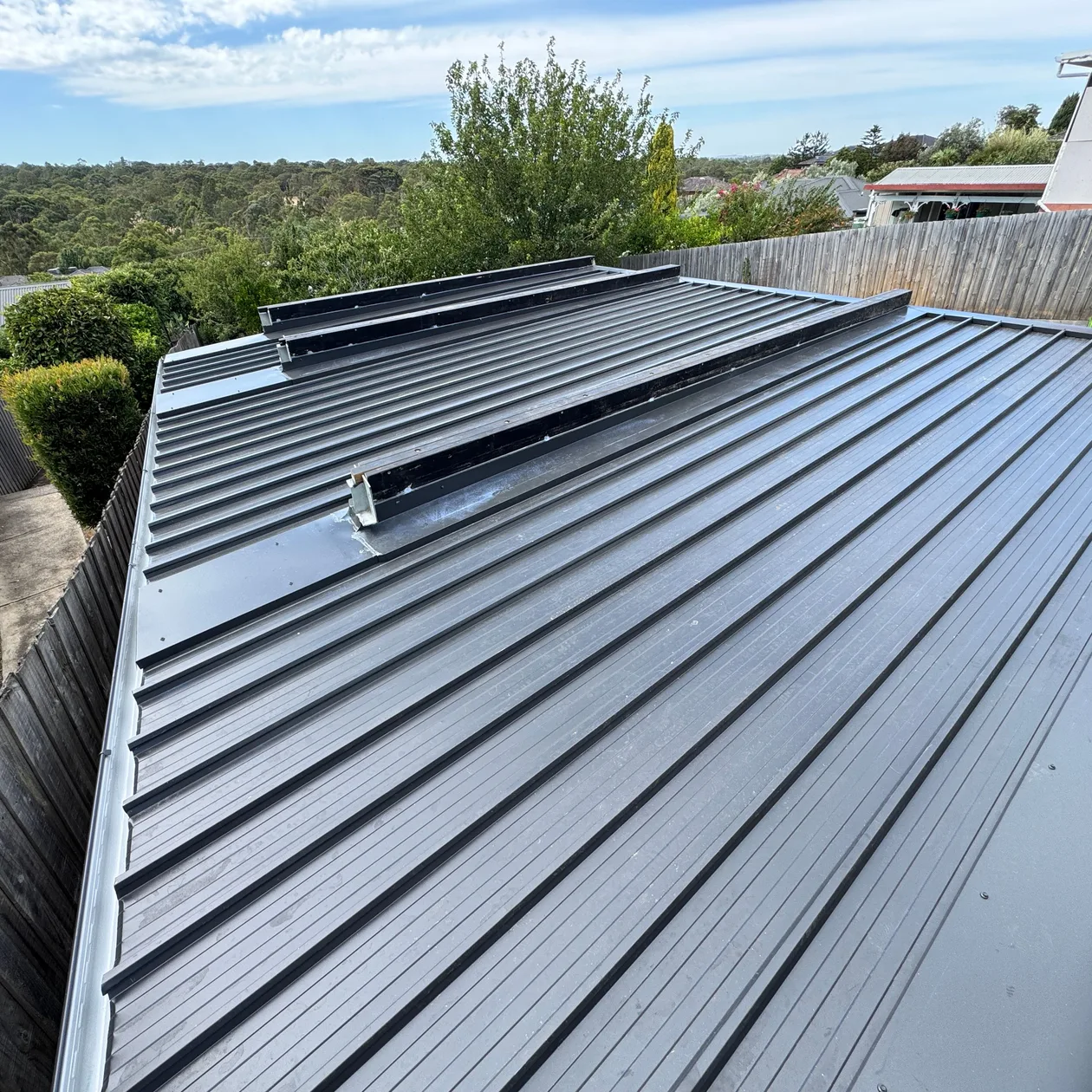Dark standing seam metal roof